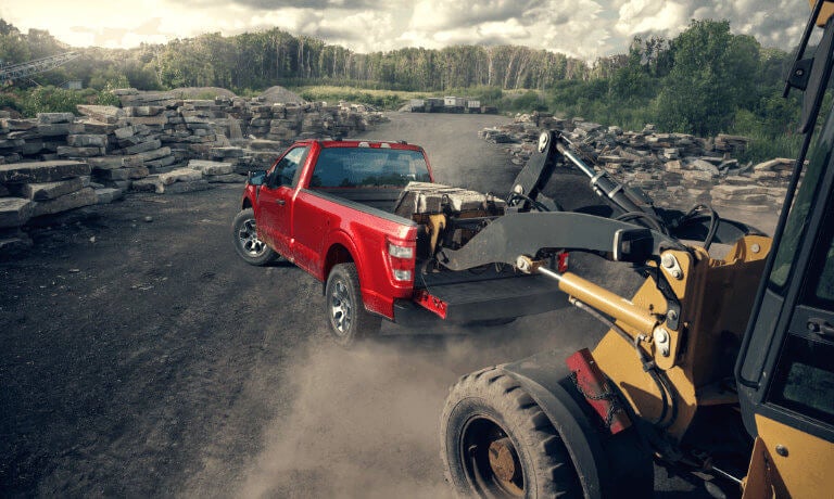 2022 Ford F-150 exterior loading rocks into bed