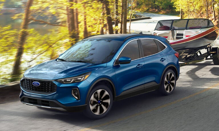 2024 Ford Escape exterior on forest highway towing boat